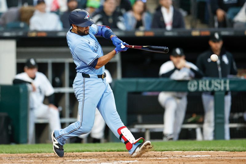 May 27, 2024; Chicago, Illinois, USA; Toronto Blue Jays third baseman Isiah Kiner-Falefa (7) hits an RBI-single against the Chicago White Sox during the fourth inning at Guaranteed Rate Field. Mandatory Credit: Kamil Krzaczynski-USA TODAY Sports