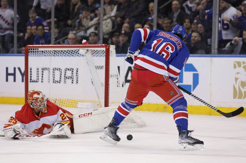 Feb 12, 2024; New York, New York, USA; Calgary Flames goaltender Jacob Markstrom (25) makes a save against New York Rangers center Vincent Trocheck (16) during the first period at Madison Square Garden. Mandatory Credit: Brad Penner-USA TODAY Sports