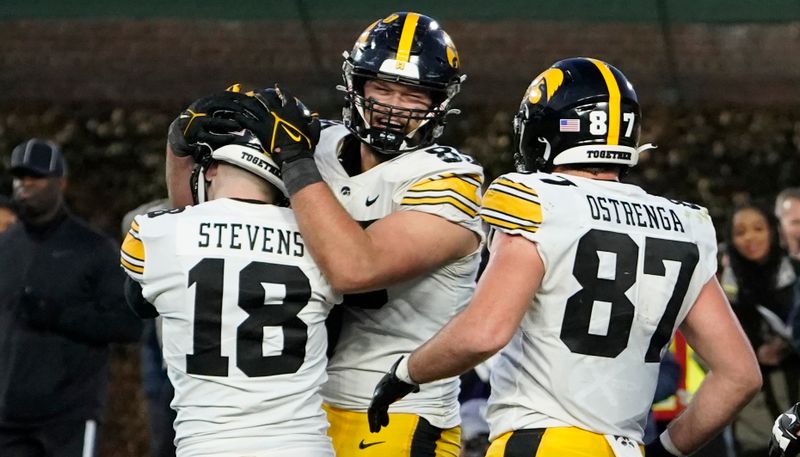 Nov 4, 2023; Chicago, Illinois, USA; Iowa Hawkeyes place kicker Drew Stevens (18) celebrates the game winning field goal against the Northwestern Wildcats during the second half at Wrigley Field. Mandatory Credit: David Banks-USA TODAY Sports