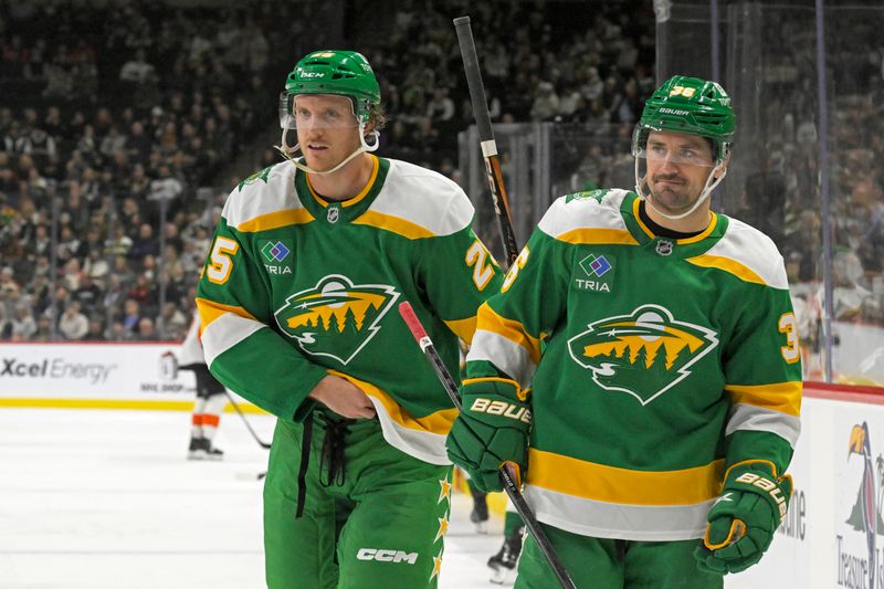 Dec 14, 2024; Saint Paul, Minnesota, USA;  Minnesota Wild defenseman Jonas Brodin (25) and forward Mats Zuccarello (36) take a breather during the third period against the Philadelphia Flyers at Xcel Energy Center. Mandatory Credit: Nick Wosika-Imagn Images