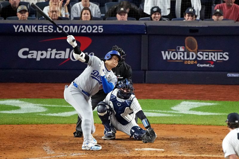 Oct 30, 2024; New York, New York, USA; Los Angeles Dodgers two-way player Shohei Ohtani (17) strikes out during the fifth inning against the New York Yankees in game four of the 2024 MLB World Series at Yankee Stadium. Mandatory Credit: Robert Deutsch-Imagn Images
