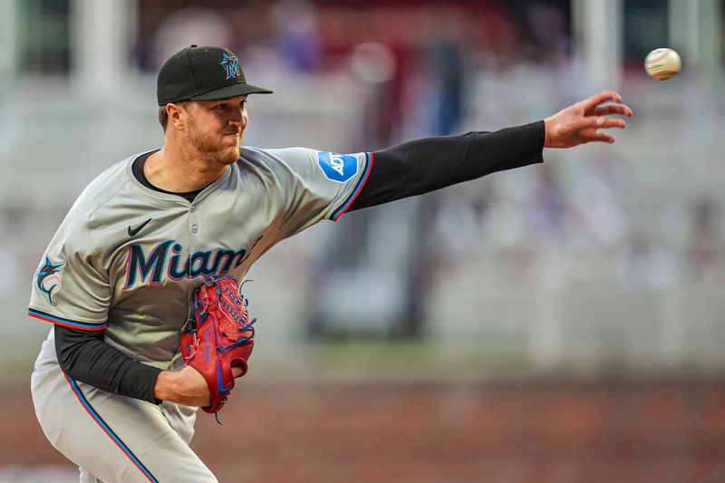 Apr 23, 2024; Cumberland, Georgia, USA; Miami Marlins pitcher Trevor Rogers (28) pitches against the Atlanta Braves during the third inning at Truist Park. Mandatory Credit: Dale Zanine-USA TODAY Sports