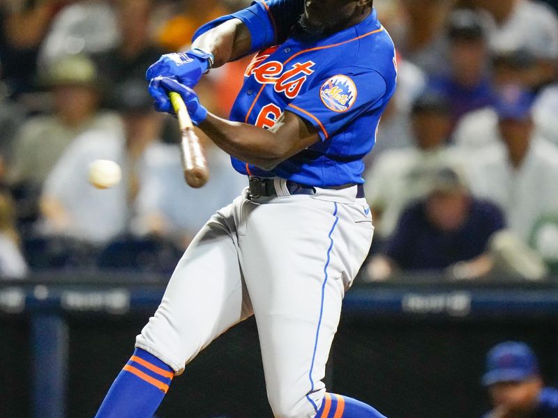 Mar 7, 2023; West Palm Beach, Florida, USA; New York Mets shortstop Ronny Mauricio (60) hits a single against the Houston Astros during the seventh inning at The Ballpark of the Palm Beaches. Mandatory Credit: Rich Storry-USA TODAY Sports