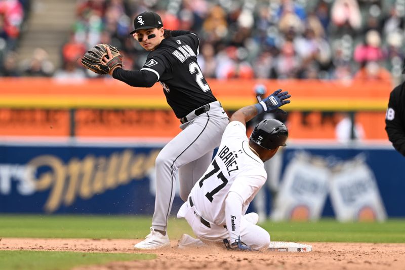 Apr 6, 2025; Detroit, Michigan, USA;  
Chicago White Sox second baseman Brooks Baldwin (27) tries to turns a double play over Detroit Tigers third baseman Andy Ibáñez (77) in the eighth inning at Comerica Park. Mandatory Credit: Lon Horwedel-Imagn Images