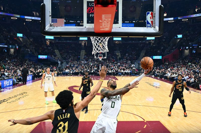 CLEVELAND, OHIO - JANUARY 17: Damian Lillard #0 of the Milwaukee Bucks shoots over Jarrett Allen #31 of the Cleveland Cavaliers during the first half at Rocket Mortgage Fieldhouse on January 17, 2024 in Cleveland, Ohio. The Cavaliers defeated the Bucks 135-95. NOTE TO USER: User expressly acknowledges and agrees that, by downloading and or using this photograph, User is consenting to the terms and conditions of the Getty Images License Agreement. (Photo by Jason Miller/Getty Images)