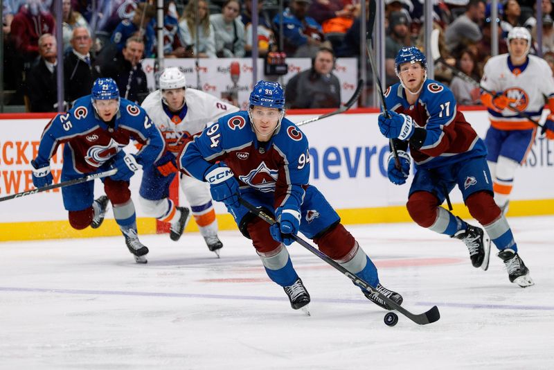 Oct 14, 2024; Denver, Colorado, USA; Colorado Avalanche left wing Joel Kiviranta (94) controls the puck in the second period against the New York Islanders at Ball Arena. Mandatory Credit: Isaiah J. Downing-Imagn Images