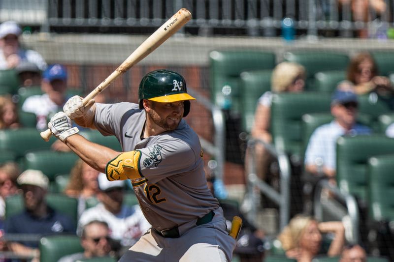 Jun 2, 2024; Cumberland, Georgia, USA;   Oakland Athletics shortstop Max Schuemann (12) waits for the pitch from the Atlanta Braves during the eighth inning at Truist Park. Mandatory Credit: Jordan Godfree-USA TODAY Sports