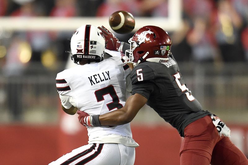 Sep 7, 2024; Pullman, Washington, USA; Washington State Cougars defensive back Tyson Durant (5) breaks up a pass intended for Texas Tech Red Raiders wide receiver Josh Kelly (3) in the first half at Gesa Field at Martin Stadium. Mandatory Credit: James Snook-Imagn Images