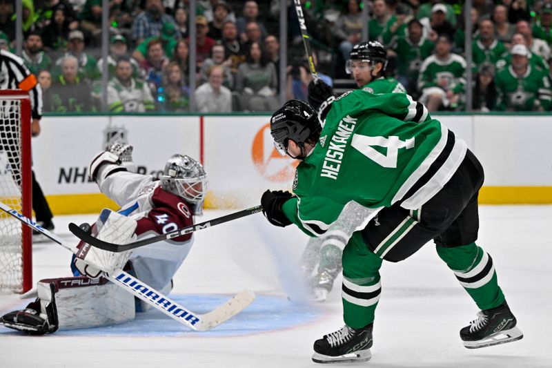 May 15, 2024; Dallas, Texas, USA; Dallas Stars defenseman Miro Heiskanen (4) scores a power play goal on a pass from left wing Jason Robertson (21) against Colorado Avalanche goaltender Alexandar Georgiev (40) during the second period in game five of the second round of the 2024 Stanley Cup Playoffs at American Airlines Center. Mandatory Credit: Jerome Miron-USA TODAY Sports