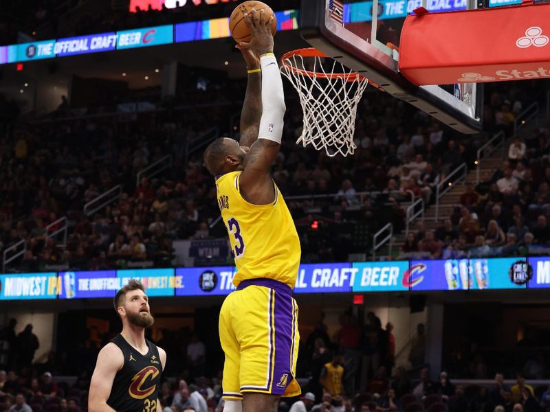 CLEVELAND, OH - OCTOBER 30:  LeBron James #23 of the Los Angeles Lakers dunks the ball during the game against the Cleveland Cavaliers on October 30, 2024 at Rocket Mortgage FieldHouse in Cleveland, Ohio. NOTE TO USER: User expressly acknowledges and agrees that, by downloading and/or using this Photograph, user is consenting to the terms and conditions of the Getty Images License Agreement. Mandatory Copyright Notice: Copyright 2024 NBAE (Photo by  Lauren Leigh Bacho/NBAE via Getty Images)