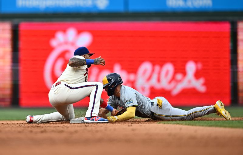 Jun 5, 2024; Philadelphia, Pennsylvania, USA; Milwaukee Brewers third baseman Joey Ortiz (3) steals second base against Philadelphia Phillies infielder Edmundo Sosa (33) in the third inning at Citizens Bank Park. Mandatory Credit: Kyle Ross-USA TODAY Sports