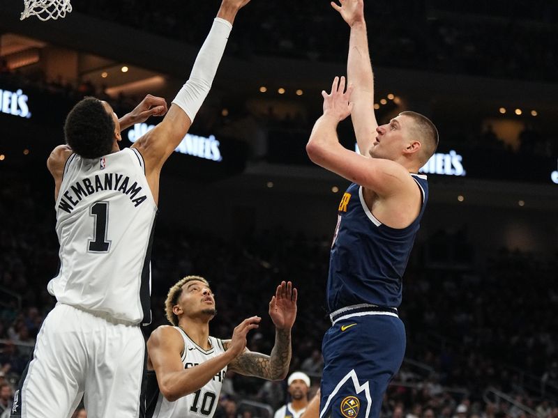 AUSTIN, TX - MARCH 15: Nikola Jokic #15 of the Denver Nuggets drives to the basket during the game against the San Antonio Spurs on March 15, 2024 at the Moody Center in Austin, Texas. NOTE TO USER: User expressly acknowledges and agrees that, by downloading and/or using this Photograph, user is consenting to the terms and conditions of the Getty Images License Agreement. Mandatory Copyright Notice: Copyright 2024 NBAE (Photo by Garrett Ellwood/NBAE via Getty Images)