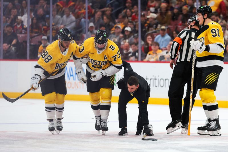 Feb 4, 2026; Sunrise, Florida, USA; Boston Bruins defenseman Charlie McAvoy (73) is helped off the ice by right wing David Pastrnak (88) after an apparent injury against the Florida Panthers during the first period at Amerant Bank Arena. Mandatory Credit: Sam Navarro-Imagn Images