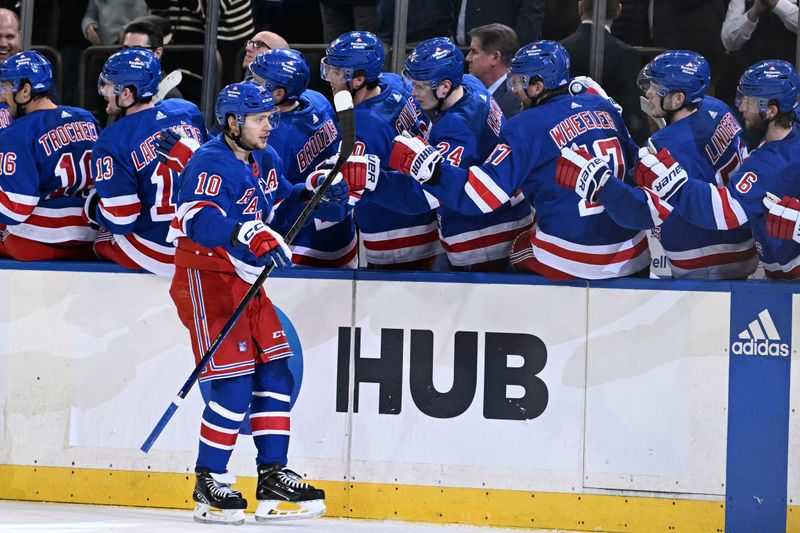 Feb 5, 2024; New York, New York, USA;  New York Rangers left wing Artemi Panarin (10) celebrates his game tying goal with the New York Rangers bench against the Colorado Avalanche during the third period at Madison Square Garden. Mandatory Credit: Dennis Schneidler-USA TODAY Sports