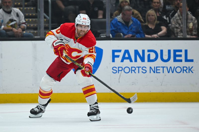 Feb 28, 2026; Los Angeles, California, USA; Calgary Flames left wing Blake Coleman (20) advances the puck across the ice during the first period against the Los Angeles Kings at Crypto.com Arena. Mandatory Credit: Griffin Hooper-Imagn Images