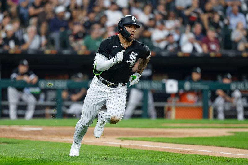 Aug 9, 2023; Chicago, Illinois, USA; Chicago White Sox third baseman Yoan Moncada (10) runs after hitting an RBI double against the New York Yankees during the third inning at Guaranteed Rate Field. Mandatory Credit: Kamil Krzaczynski-USA TODAY Sports