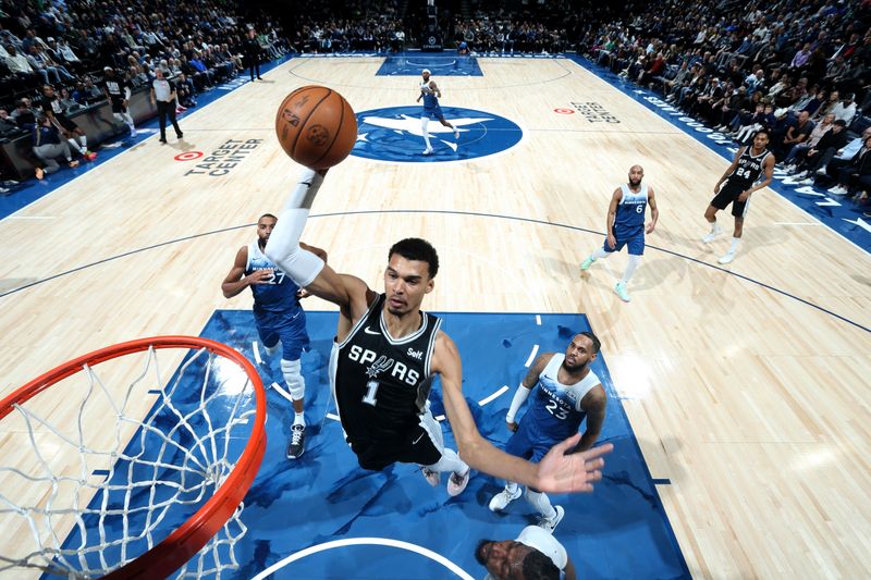 MINNEAPOLIS, MN -  FEBRUARY 27: Victor Wembanyama #1 of the San Antonio Spurs dunks the ball during the game against the Minnesota Timberwolves on February 27, 2024 at Target Center in Minneapolis, Minnesota. NOTE TO USER: User expressly acknowledges and agrees that, by downloading and or using this Photograph, user is consenting to the terms and conditions of the Getty Images License Agreement. Mandatory Copyright Notice: Copyright 2024 NBAE (Photo by David Sherman/NBAE via Getty Images)