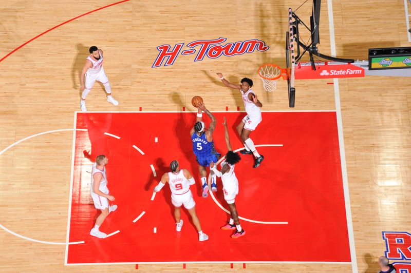 HOUSTON, TX - APRIL 9: Paolo Banchero #5 of the Orlando Magic shoots the ball during the game against the Houston Rockets on April 9, 2024 at the Toyota Center in Houston, Texas. NOTE TO USER: User expressly acknowledges and agrees that, by downloading and or using this photograph, User is consenting to the terms and conditions of the Getty Images License Agreement. Mandatory Copyright Notice: Copyright 2024 NBAE (Photo by Logan Riely/NBAE via Getty Images)