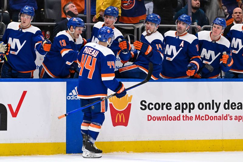 Mar 5, 2024; Elmont, New York, USA;  New York Islanders center Jean-Gabriel Pageau (44) celebrates with teammates after scoring during the second period against the St. Louis Blues at UBS Arena. Mandatory Credit: Dennis Schneidler-USA TODAY Sports