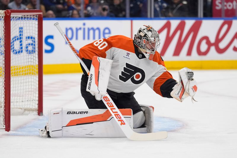 Mar 2, 2026; Toronto, Ontario, CAN; Philadelphia Flyers goaltender Dan Vladar (80) makes a glove save against the Toronto Maple Leafs during the first period at Scotiabank Arena. Mandatory Credit: John E. Sokolowski-Imagn Images