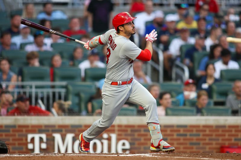 Sep 7, 2023; Atlanta, Georgia, USA; St. Louis Cardinals third baseman Nolan Arenado (28) hits a single against the Atlanta Braves in the second inning at Truist Park. Mandatory Credit: Brett Davis-USA TODAY Sports