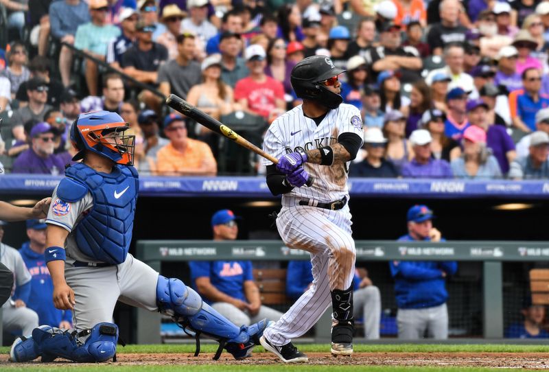 May 28, 2023; Denver, Colorado, USA; Colorado Rockies second baseman Harold Castro (30) hits a single in the third inning against the New York Mets at Coors Field. Mandatory Credit: John Leyba-USA TODAY Sports