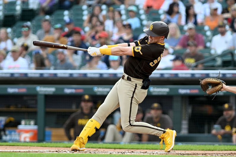 Jul 21, 2023; Detroit, Michigan, USA;  San Diego Padres first baseman Jake Cronenworth (9) hits a two-run triple off Detroit Tigers starting pitcher Reese Olson (45) (not pictured) in the first inning at Comerica Park. Mandatory Credit: Lon Horwedel-USA TODAY Sports