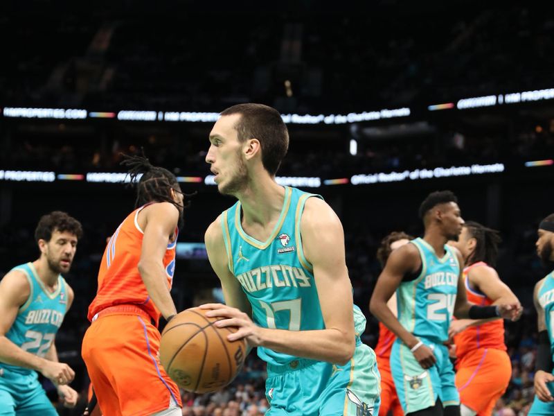 CHARLOTTE, NC - APRIL 7: Aleksej Pokusevski #17 of the Charlotte Hornets dribbles the ball during the game against the Oklahoma City Thunder on April 7, 2024 at Spectrum Center in Charlotte, North Carolina. NOTE TO USER: User expressly acknowledges and agrees that, by downloading and or using this photograph, User is consenting to the terms and conditions of the Getty Images License Agreement.  Mandatory Copyright Notice:  Copyright 2024 NBAE (Photo by Brock Williams-Smith/NBAE via Getty Images)