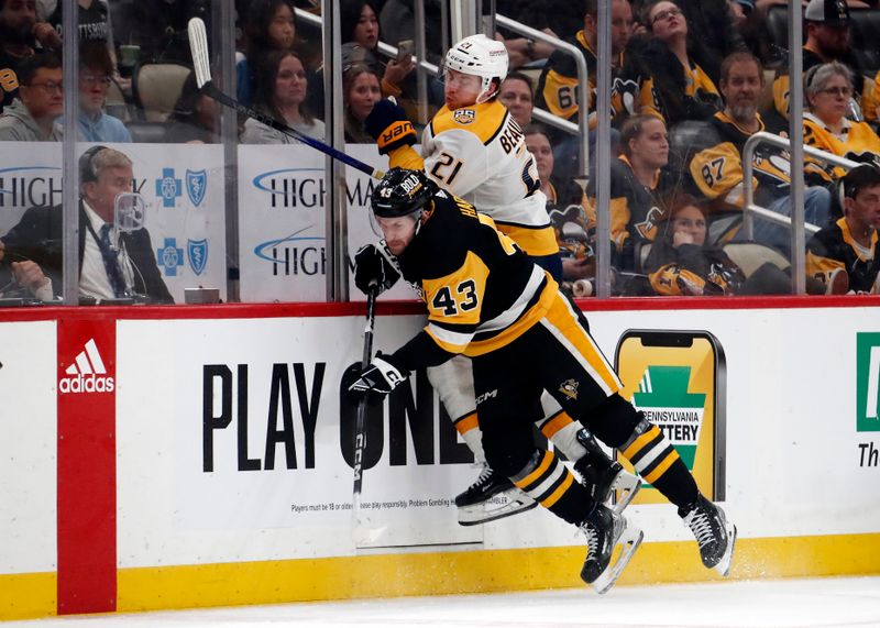 Apr 15, 2024; Pittsburgh, Pennsylvania, USA;  Pittsburgh Penguins center Jansen Harkins (43) checks Nashville Predators left wing Anthony Beauvillier (21) during the third period at PPG Paints Arena. The Penguins won 4-2. Mandatory Credit: Charles LeClaire-USA TODAY Sports