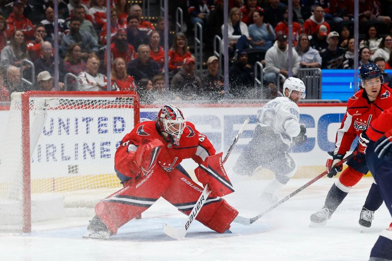 Oct 14, 2025; Washington, District of Columbia, USA; Washington Capitals goaltender Logan Thompson (48) prepares to make a save against the Tampa Bay Lightning in the second period at Capital One Arena. Mandatory Credit: Geoff Burke-Imagn Images