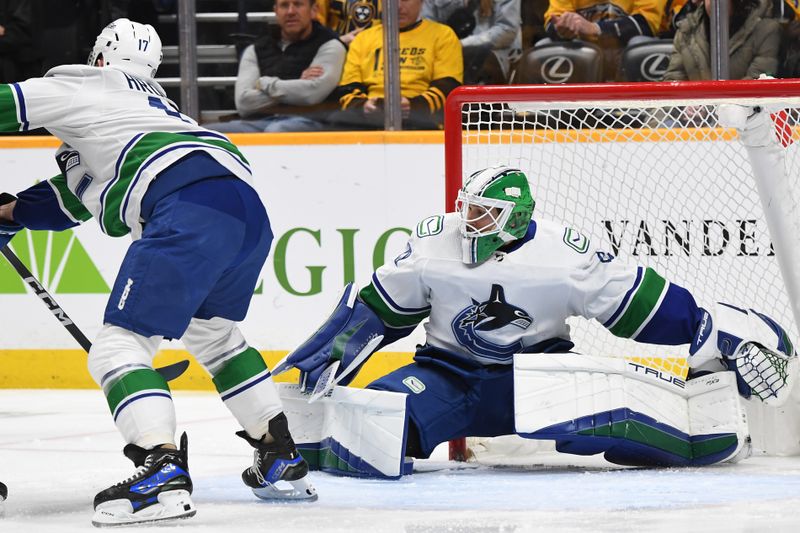 Dec 19, 2023; Nashville, Tennessee, USA; Vancouver Canucks goaltender Casey DeSmith (29) makes a save during the first period against the Nashville Predators at Bridgestone Arena. Mandatory Credit: Christopher Hanewinckel-USA TODAY Sports