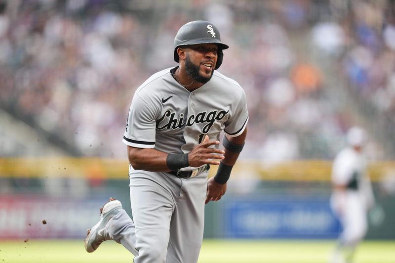 Aug 19, 2023; Denver, Colorado, USA; Chicago White Sox shortstop Elvis Andrus (1) heads home to score a run in the first inning against the Colorado Rockies at Coors Field. Mandatory Credit: Ron Chenoy-USA TODAY Sports