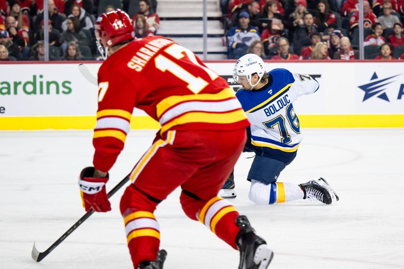 Dec 5, 2024; Calgary, Alberta, CAN; St. Louis Blues center Zachary Bolduc (76) scores a goal against the Calgary Flames during the first period at Scotiabank Saddledome. Mandatory Credit: Brett Holmes-Imagn Images