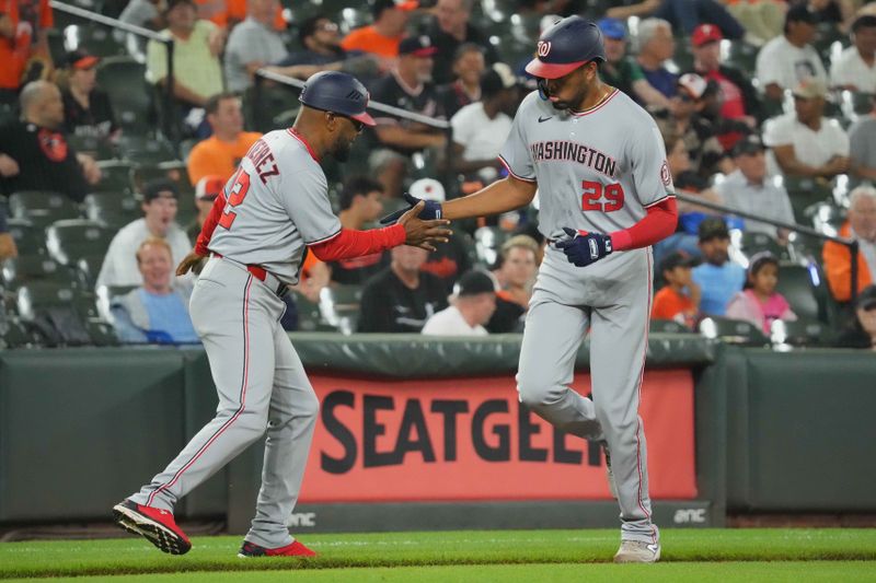 May 16, 2025; Baltimore, Maryland, USA; Washington Nationals designated hitter James Wood (29) is greeted by coach Ricky Gutierrez (12) following his solo home run in the eighth inning against the Baltimore Orioles at Oriole Park at Camden Yards. Mandatory Credit: Mitch Stringer-Imagn Images