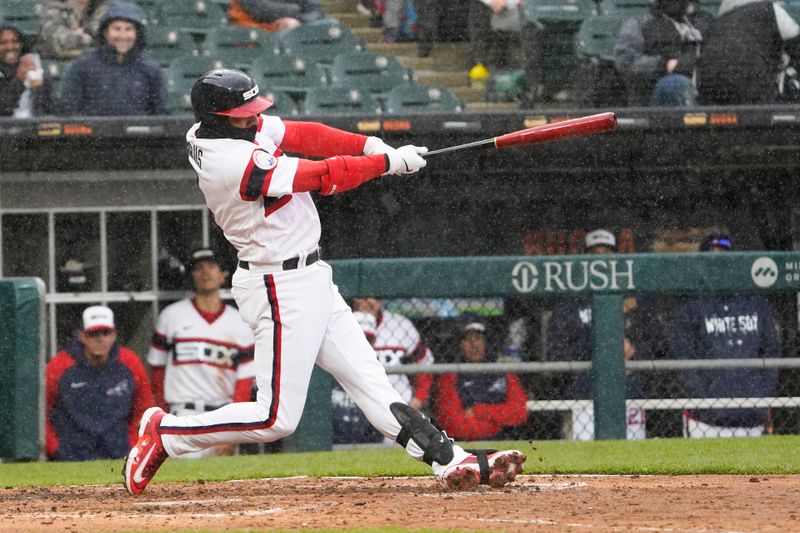 Apr 30, 2023; Chicago, Illinois, USA; Chicago White Sox shortstop Elvis Andrus (1) hits a single against the Tampa Bay Rays during the sixth inning at Guaranteed Rate Field. Mandatory Credit: David Banks-USA TODAY Sports