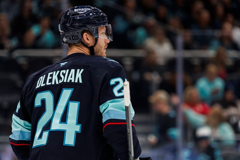 Oct 8, 2024; Seattle, Washington, USA; Seattle Kraken defenseman Jamie Oleksiak (24) looks on against the St. Louis Blues during the second period at Climate Pledge Arena. Mandatory Credit: Caean Couto-Imagn Images