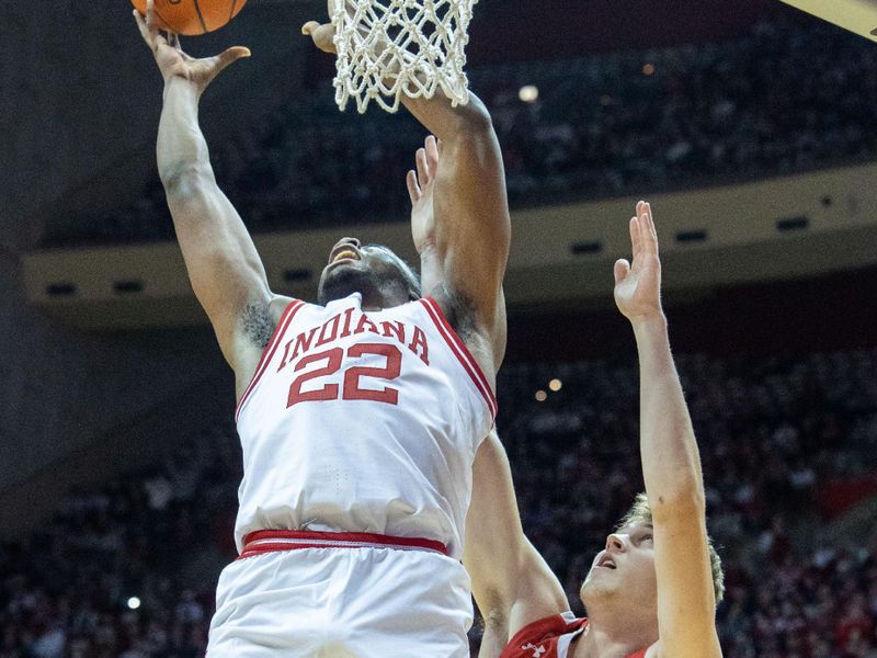 Jan 14, 2023; Bloomington, Indiana, USA; Indiana Hoosiers forward Jordan Geronimo (22) shoots the ball while Wisconsin Badgers forward Markus Ilver (35) defends in the first half at Simon Skjodt Assembly Hall. Mandatory Credit: Trevor Ruszkowski-USA TODAY Sports