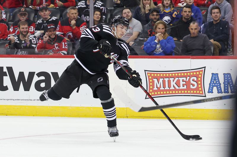 Oct 27, 2023; Newark, New Jersey, USA; New Jersey Devils defenseman Luke Hughes (43) shoots the puck during the first period against the Buffalo Sabres at Prudential Center. Mandatory Credit: Vincent Carchietta-USA TODAY Sports