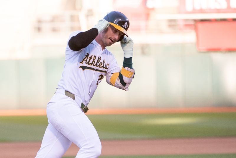 Jul 2, 2024; Oakland, California, USA; Oakland Athletics outfielder Brent Rooker (25) rounds the bases after hitting a home run against the Los Angeles Angels during the fourth inning at Oakland-Alameda County Coliseum. Mandatory Credit: Ed Szczepanski-USA TODAY Sports