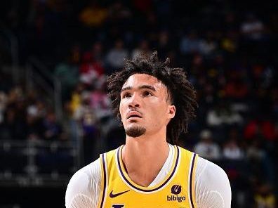 DETROIT, MI - NOVEMBER 29: Jalen Hood-Schifino #0 of the Los Angeles Lakers  shoots a free throw during the game against the Detroit Pistons on November 29, 2023 at Little Caesars Arena in Detroit, Michigan. NOTE TO USER: User expressly acknowledges and agrees that, by downloading and/or using this photograph, User is consenting to the terms and conditions of the Getty Images License Agreement. Mandatory Copyright Notice: Copyright 2023 NBAE (Photo by Chris Schwegler/NBAE via Getty Images)