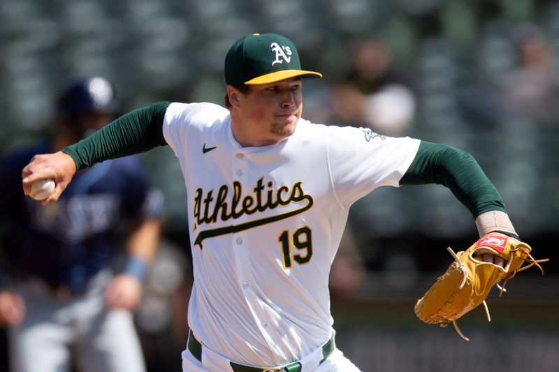 Aug 22, 2024; Oakland, California, USA; Oakland Athletics pitcher Mason Miller (19) delivers a pitch against the Tampa Bay Rays during the ninth inning at Oakland-Alameda County Coliseum. Mandatory Credit: D. Ross Cameron-USA TODAY Sports