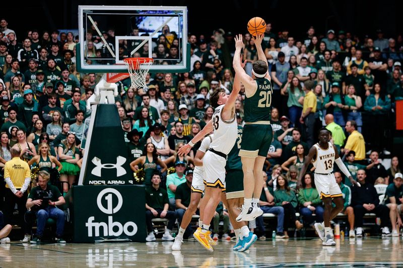 Mar 2, 2024; Fort Collins, Colorado, USA; Colorado State Rams guard Joe Palmer (20) attempts a shot against Wyoming Cowboys forward Mason Walters (33) in the second half at Moby Arena. Mandatory Credit: Isaiah J. Downing-USA TODAY Sports