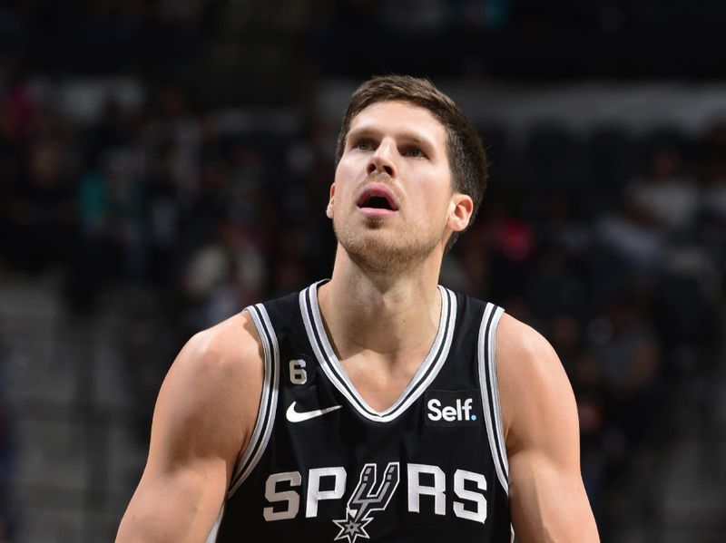 SAN ANTONIO, TX - DECEMBER 26:  Doug McDermott #17 of the San Antonio Spurs shoots a free throw against the Utah Jazz on December 26, 2022 at the AT&T Center in San Antonio, Texas. NOTE TO USER: User expressly acknowledges and agrees that, by downloading and or using this photograph, user is consenting to the terms and conditions of the Getty Images License Agreement. Mandatory Copyright Notice: Copyright 2022 NBAE (Photos by Michael Gonzales/NBAE via Getty Images)