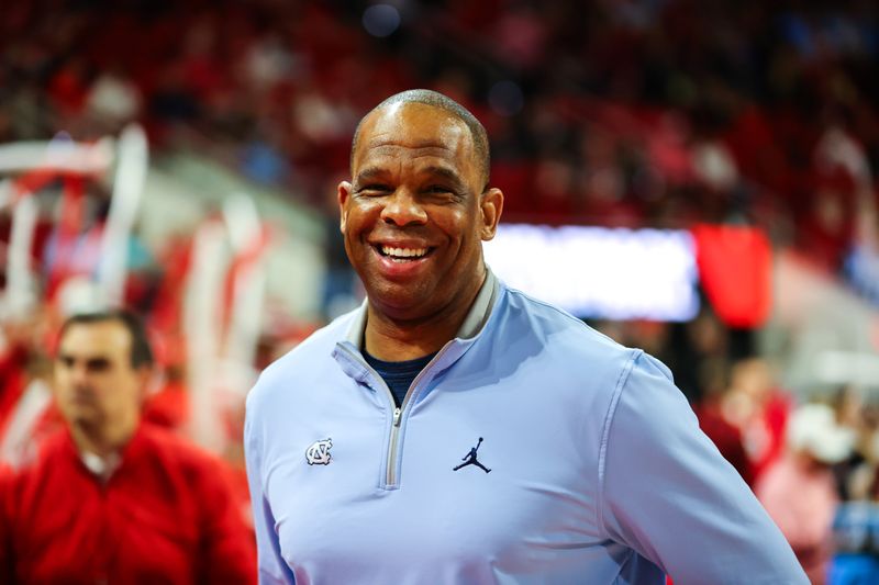 Feb 19, 2023; Raleigh, North Carolina, USA; North Carolina Tar Heels head coach Hubert Davis reacts before the first half of the game against North Carolina State Wolfpack at PNC Arena. Mandatory Credit: Jaylynn Nash-USA TODAY Sports