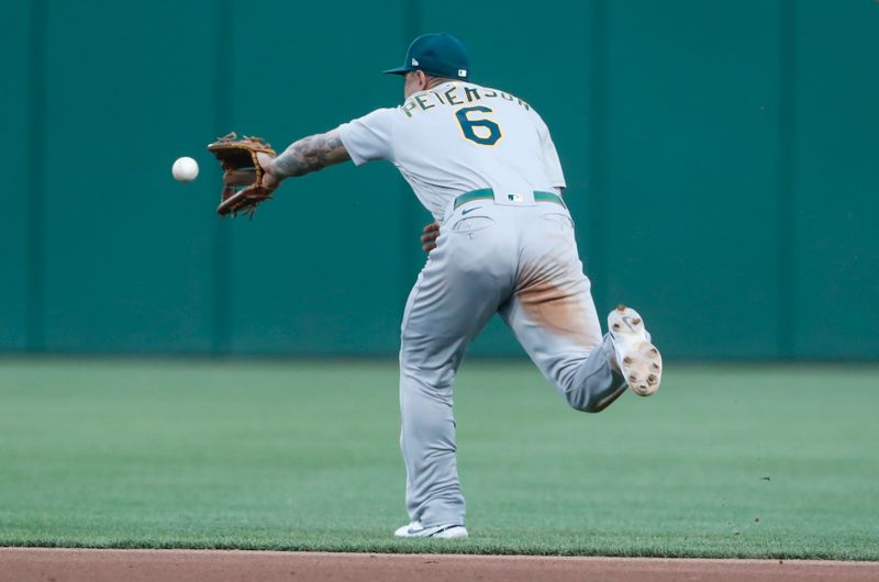 Jun 6, 2023; Pittsburgh, Pennsylvania, USA;  Oakland Athletics third baseman Jace Peterson (6) chases down a ball hit for a single by Pittsburgh Pirates left fielder Bryan Reynolds (not pictured) during the fifth inning at PNC Park. Mandatory Credit: Charles LeClaire-USA TODAY Sports