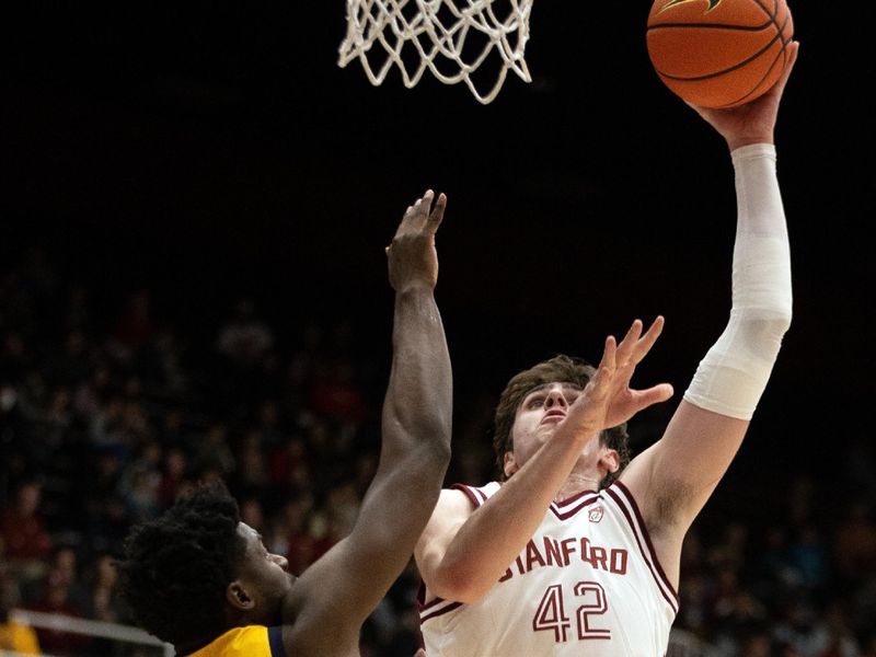 Jan 28, 2023; Stanford, California, USA; Stanford Cardinal forward Maxime Raynaud (42) shoots over California Golden Bears forward ND Okafor (22) during the first half at Maples Pavilion. Mandatory Credit: D. Ross Cameron-USA TODAY Sports