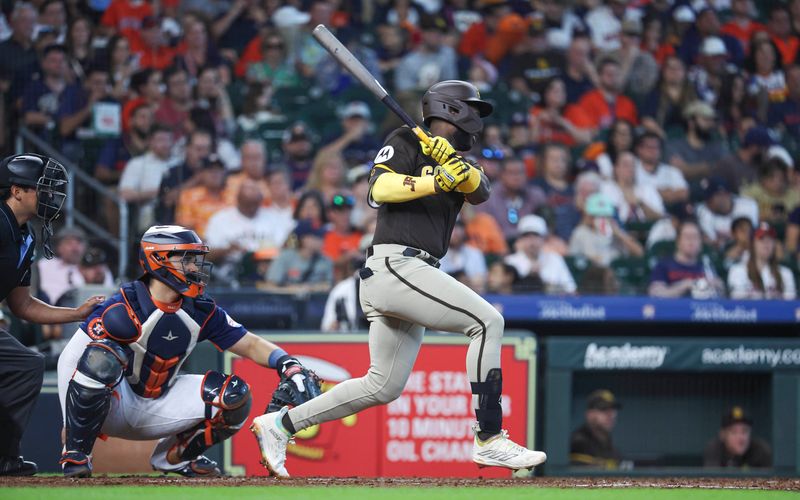 Sep 10, 2023; Houston, Texas, USA; San Diego Padres right fielder Jurickson Profar (10) hits a single during the fifth inning against the Houston Astros at Minute Maid Park. Mandatory Credit: Troy Taormina-USA TODAY Sports