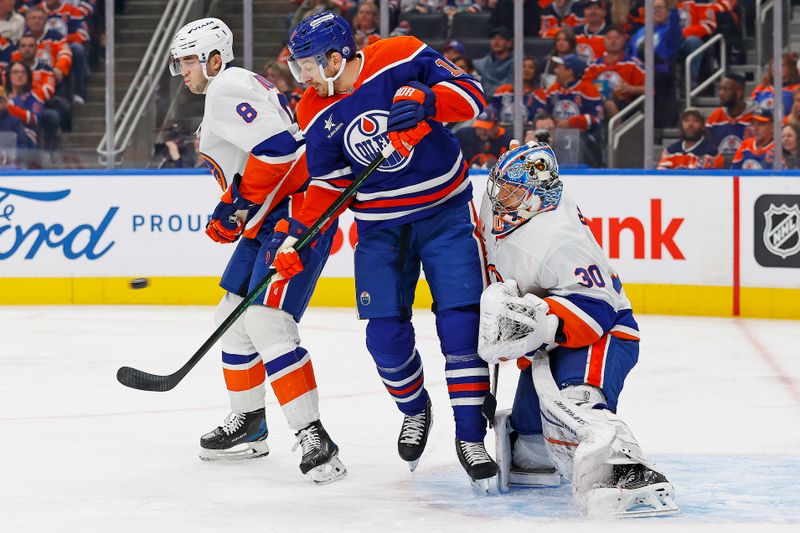 Nov 12, 2024; Edmonton, Alberta, CAN; Edmonton Oilers forward Zach Hyman (18) deflects a shot in front of New York Islanders goaltender Ilya Sorokin (30) during the first period at Rogers Place. Mandatory Credit: Perry Nelson-Imagn Images