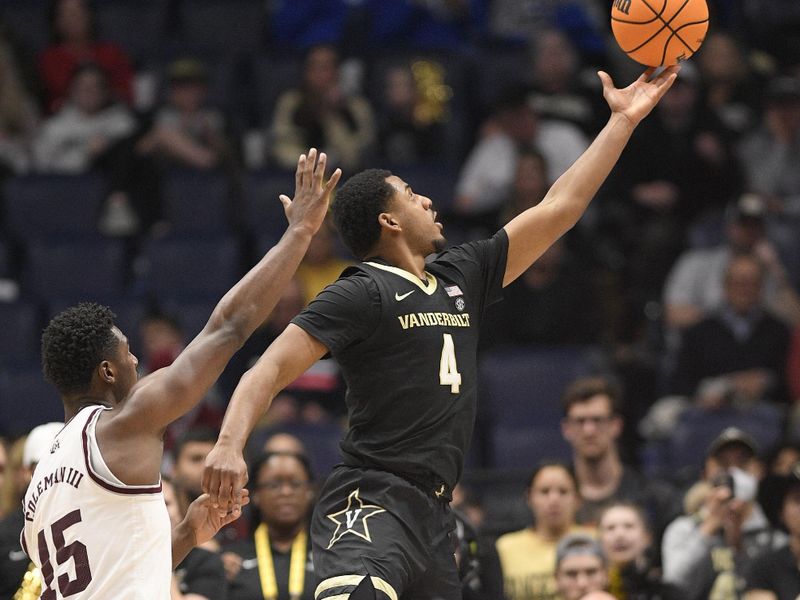 Mar 11, 2023; Nashville, TN, USA;  Vanderbilt Commodores guard Jordan Wright (4) lays the ball in against the Texas A&M during the second half at Bridgestone Arena. Mandatory Credit: Steve Roberts-USA TODAY Sports