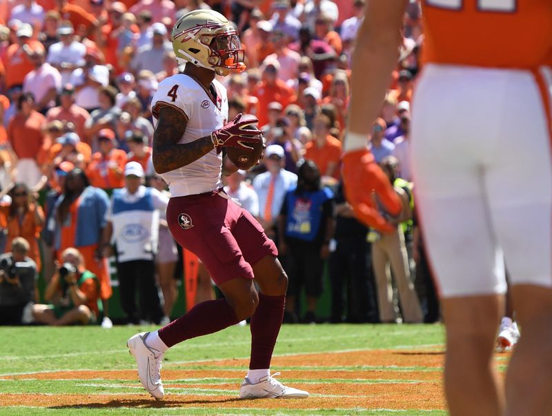 Sep 23, 2023; Clemson, South Carolina, USA; Florida State Seminoles receiver Keon Coleman (4) scores against the Clemson Tigers during the second quarter at Memorial Stadium. Mandatory Credit: Ken Ruinard-USA TODAY Sports